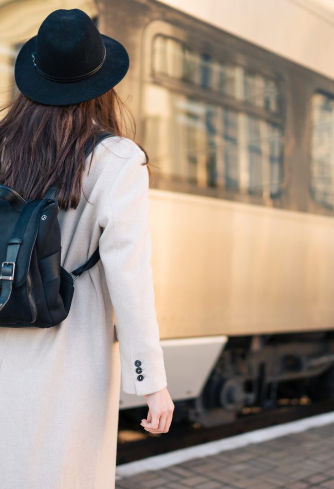 Tourist girl at railway station platform
